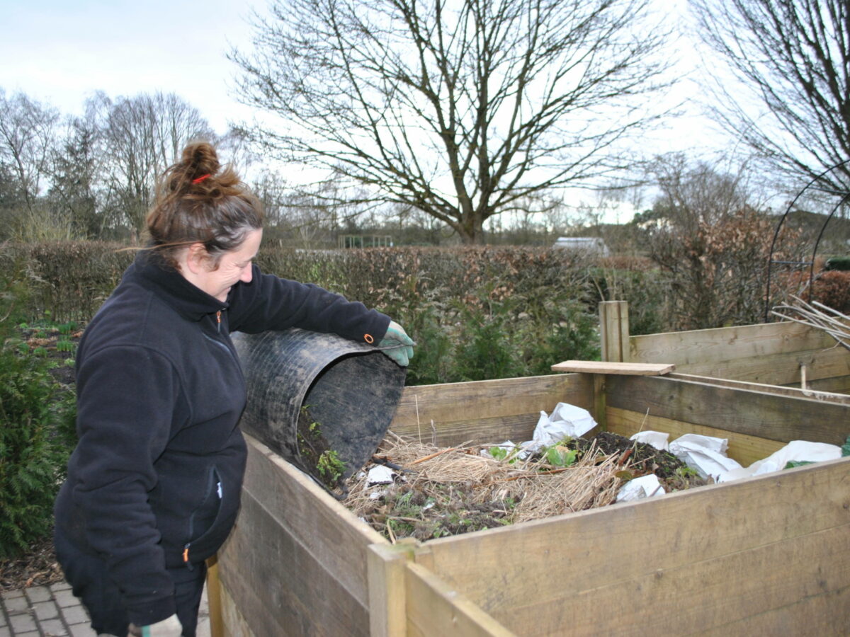 Emma adding to compost heap