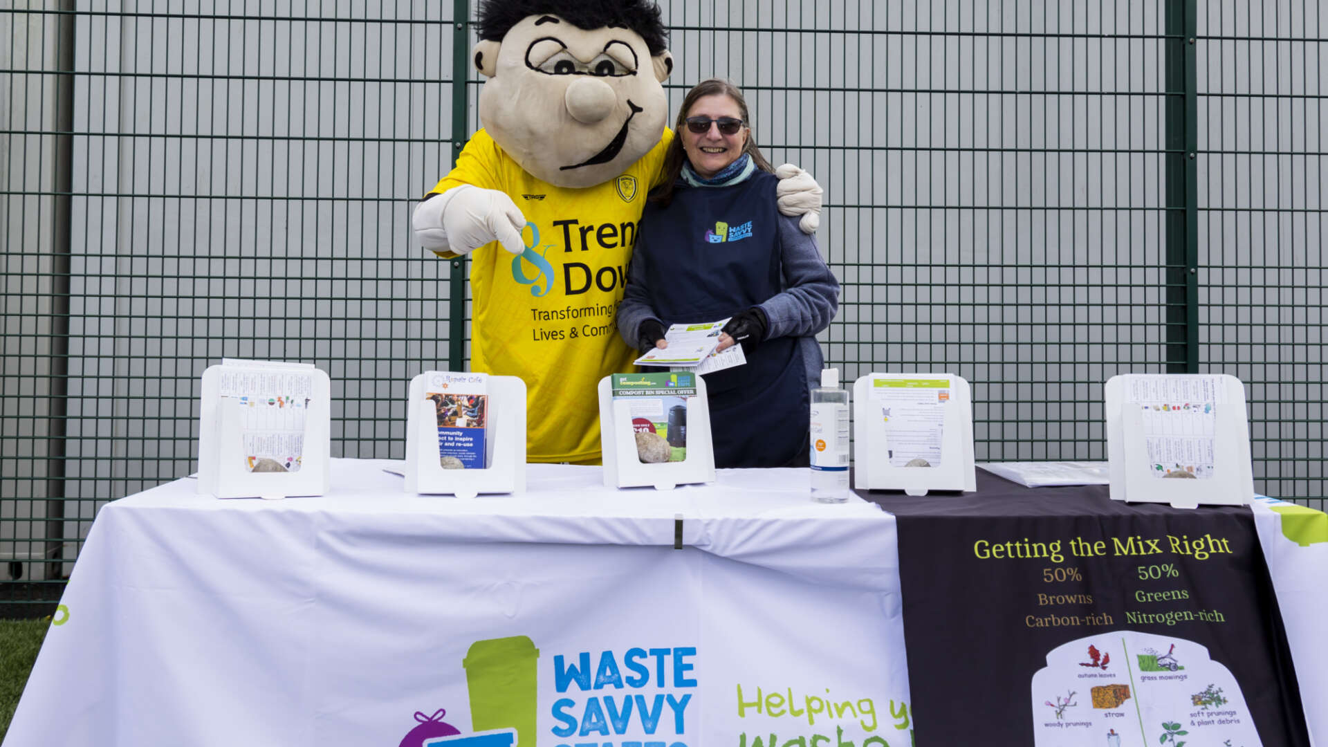 Master Composters stand at a football game