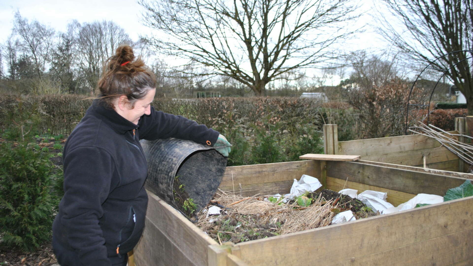Emma adding to compost heap