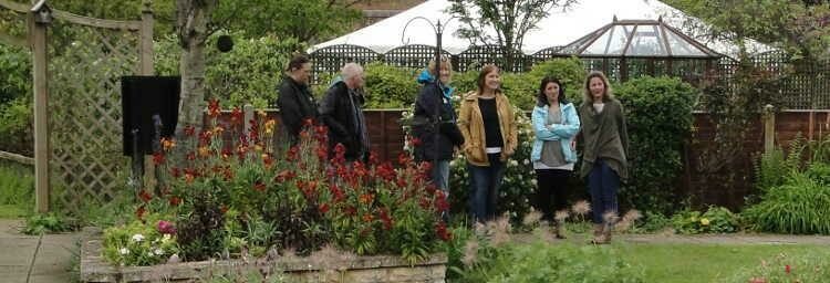 People in a garden at a dementia event